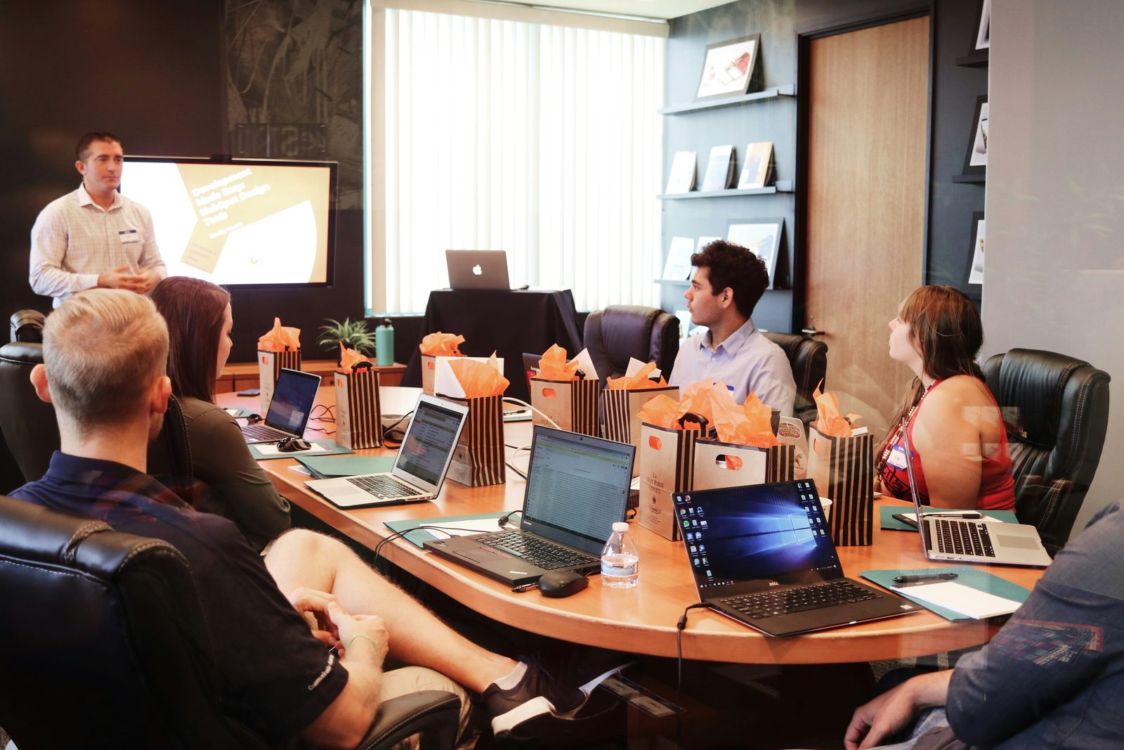 Rocoto Solutions team reviewing a product development presentation in a conference room